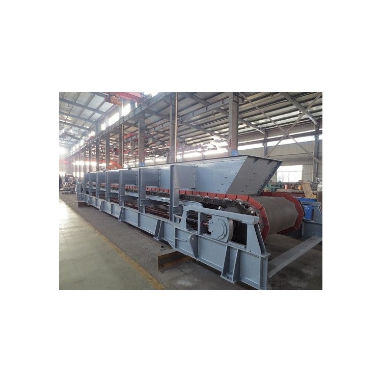 红土镍矿板式喂料机头部清扫装置