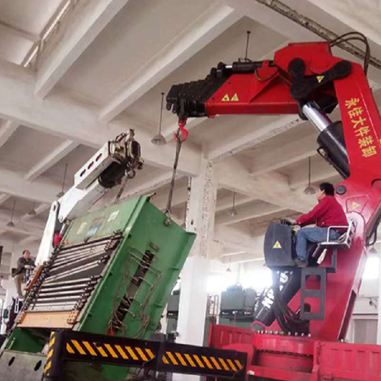 55 tons of yellow flower machinery hoisted and positioned on the upper floor